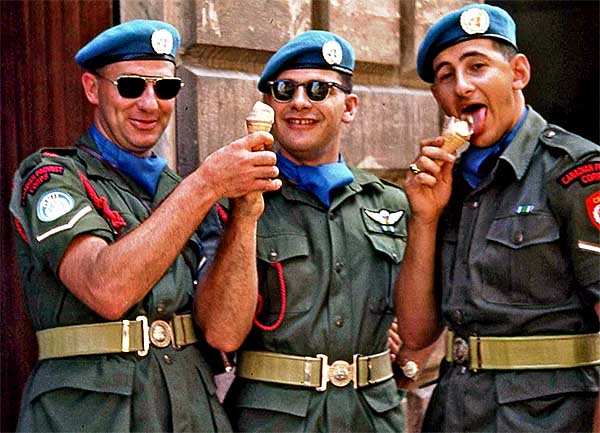 A/Sgt Jean Guy Plante, right,  C Pro C, enjoying an ice cream cone while serving with the UN Force
in the Congo - 1964.
